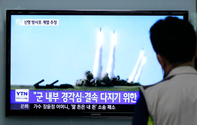 A man watches a TV news program showing the missile launch conducted by North Korea, at Seoul Railway Station in Seoul, South Korea, Thursday, June 26, 2014. North Korea fired three short-range projectiles Thursday into the waters off its east coast, a South Korean defense official said. The move was most likely a routine test-firing, but the official said it could also be meant to stoke tensions with Seoul. The writing on tje screen reads 