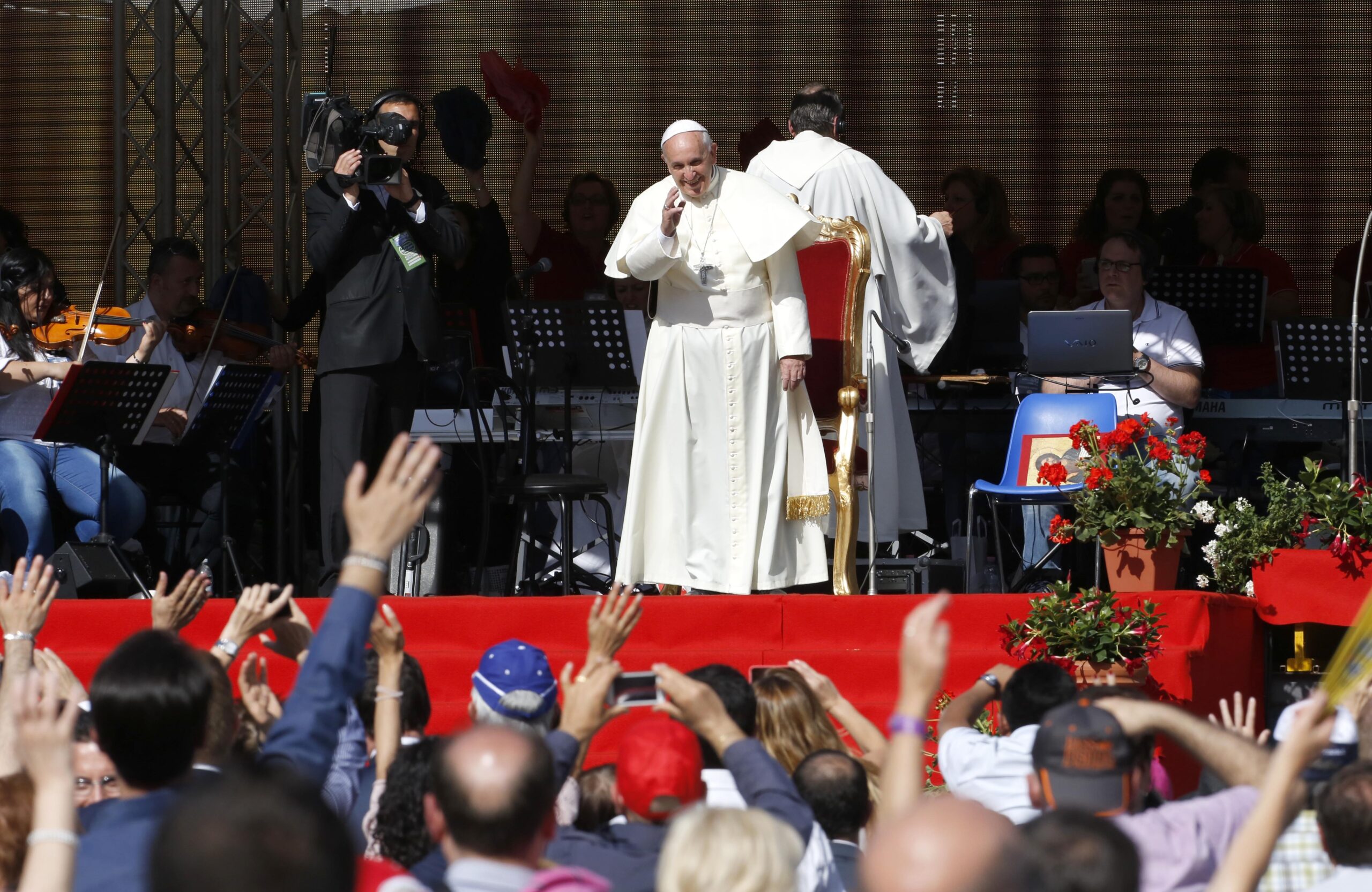Pope to packed stadium: families are under attack