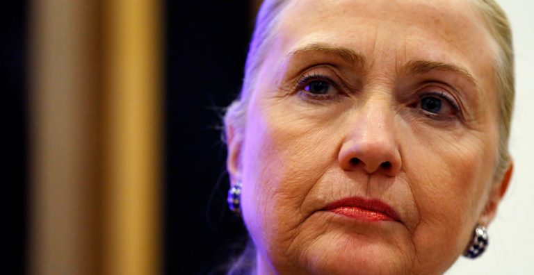   Secretary of State Hillary Rodham Clinton listens to a question during a joint news conference with Irish Taoiseach Enda Kenny at the government building in Dublin, Ireland, Thursday, Dec. 6, 2012. Clinton was in Ireland to attend the Organization of Security and Cooperation in Europe (OSCE) conference. (AP Photo/Kevin Lamarque, Pool)  