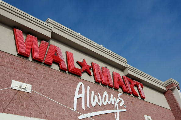 OAKLAND, CA - JANUARY 08:  The Wal-Mart logo is displayed on the exterior of a Wal-Mart store January 8, 2009 in Oakland, California. Wal-Mart has posted weaker than expected same store sales for December and has lowered its fourth quarter earnings forecast to 91 cents to 94 cents $1.03 to $1.07 a share.  (Photo by Justin Sullivan/Getty Images)