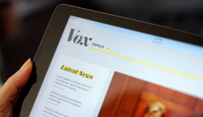 In this 2015 photo, Vox's website is displayed on an iPad held by an Associated Press staffer in Los Angeles. Vox Union, a group affiliated with the Writers Guild of America East, has accused Vox Media, the parent company of the popular liberal news site Vox, of 