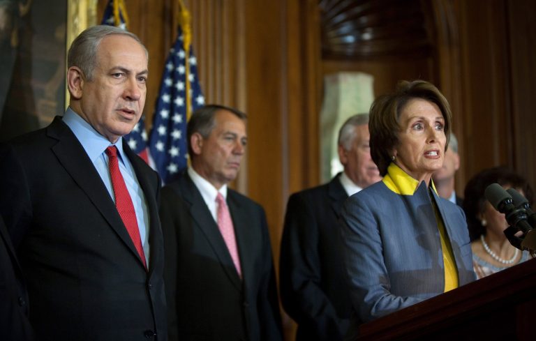 House Minority Leader Nancy Pelosi addresses the press as Israeli Prime Minister Benjamin Netanyahu and Speaker of the House John Boehnerlook on at a press conference during a meeting in the U.S. Capitol building March 6, 2012 in Washington. (Photo by Allison Shelley/Getty images)