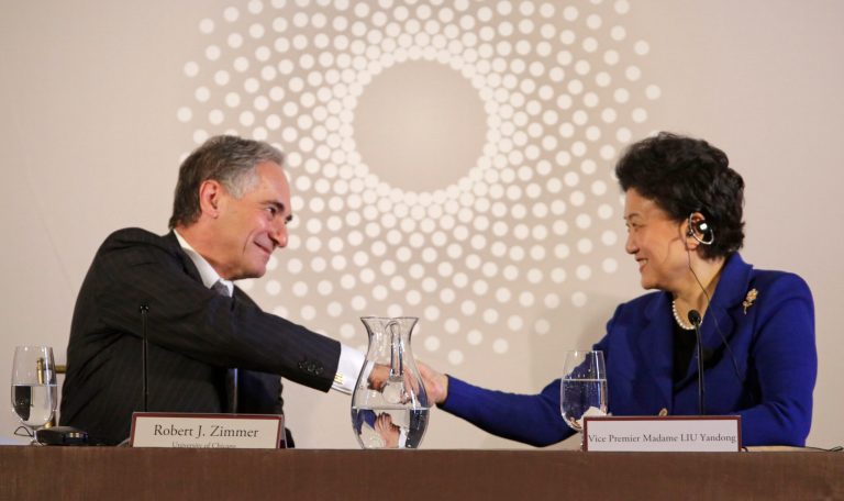 FILE - In this Nov. 18, 2013 file photo, University of Chicago president Robert J. Zimmer, left, shakes hands with Vice Premier Liu Yandong of China, after she finished her remarks at the U.S.-China University Presidents Roundtable at the University of Chicago.   Presidents at 42 private colleges scaled the $1 million annual mark in total pay and benefits in 2011, a slight bump from the year before, according to a survey based on the latest federal tax information from the 500 private schools with the largest endowments.   (AP Photo/M. Spencer Green)