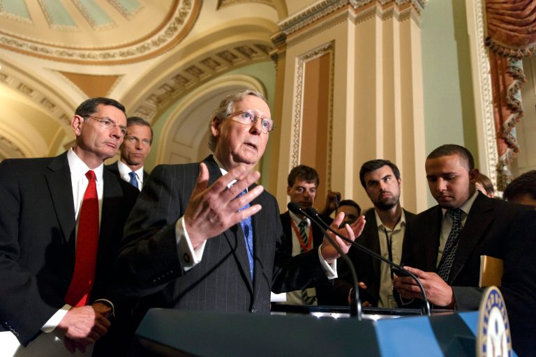 Senate Minority Leader Mitch McConnell, R-Ky., joined by Sen. John Barrasso, R-Wyo., left, and Sen. John Thune, R-S.D., rear left, speaks to reporters after a Republican caucus meeting, at the Capitol in Washington, Tuesday, May 6, 2014. (AP Photo/J. Scott Applewhite)