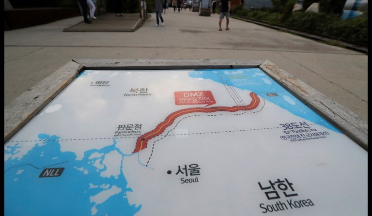 Visitors walk by the map of South Korea and North Korea at the Imjingak Pavilion in Paju, South Korea, Sunday, Sept. 3, 2017. North Korea says it has detonated a thermonuclear weapon at an underground testing facility in its sixth and most powerful nuclear test to date. (AP Photo/Lee Jin-man)