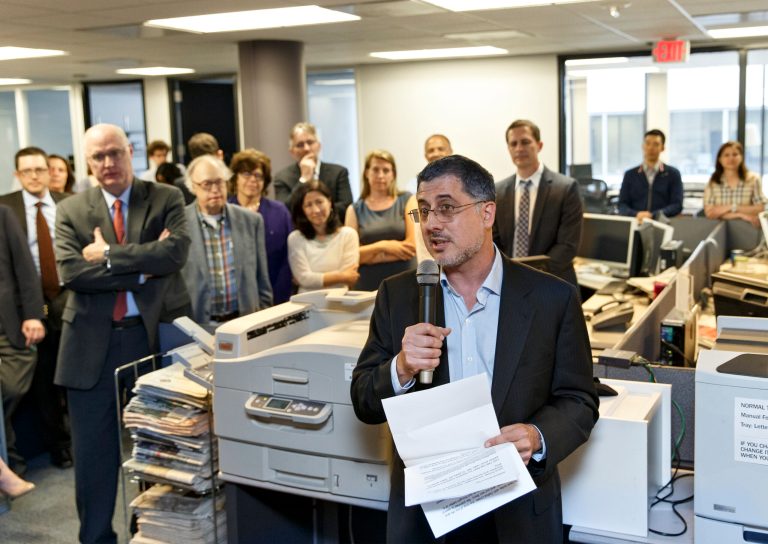 After the Pulitzer Prize for Public Service was awarded to The Washington Post, reporters and editors gather in the newsroom in Washington on Monday. (AP Photo/J. Scott Applewhite)