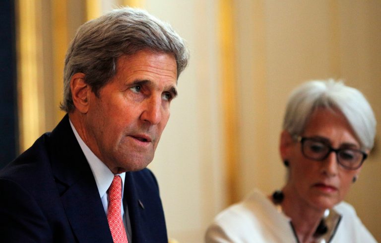 U.S. Secretary of State John Kerry, left, talks to reporters alongside U.S. Under Secretary for Political Affairs Wendy Sherman as they meet with the Iranian delegation at a hotel in Vienna, Austria, Saturday, June 27, 2015. (Carlos Barria/Pool Photo via AP)