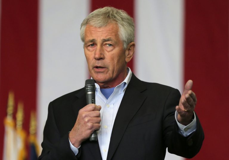 Secretary of Defense Chuck Hagel speaks to U.S. military personnel upon his arrival at the Yokota Air Base on the outskirts of Tokyo on Saturday. (AP Photo/Eugene Hoshiko)