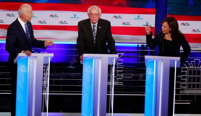 Democratic presidential candidate former Vice-President Joe Biden, left, and Sen. Kamala Harris spar during the Democratic primary debate with Sen. Bernie Sanders in the center.