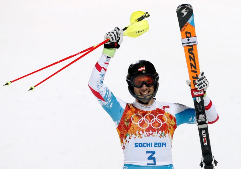Austria's Mario Matt celebrates winning the gold medal in the men's slalom at the Sochi 2014 Winter Olympics, Saturday, Feb. 22, 2014, in Krasnaya Polyana, Russia.  (AP Photo/Christophe Ena)