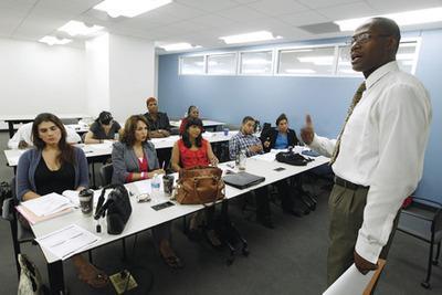 Jose Luis Magana/AP file
Rodney Brown speak to students during the Project Empowerment workshop at the Department of Employment Services in Washington. Washington's program is one of several transgender-oriented career development classes, workshops and job fairs that have popped up around the country.