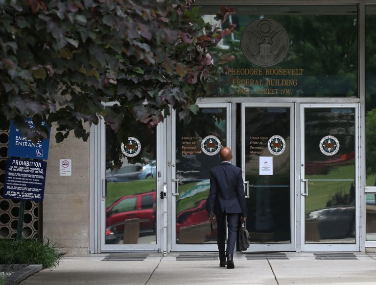 The entrance to the Theodore Roosevelt Federal Building that houses the Office of Personnel Management headquarters is shown June 5, 2015 in Washington, DC. U.S. investigators have said that at least four million current and former federal employees might have had their personal information stolen by Chinese hackers. (Photo by Mark Wilson/Getty Images)
