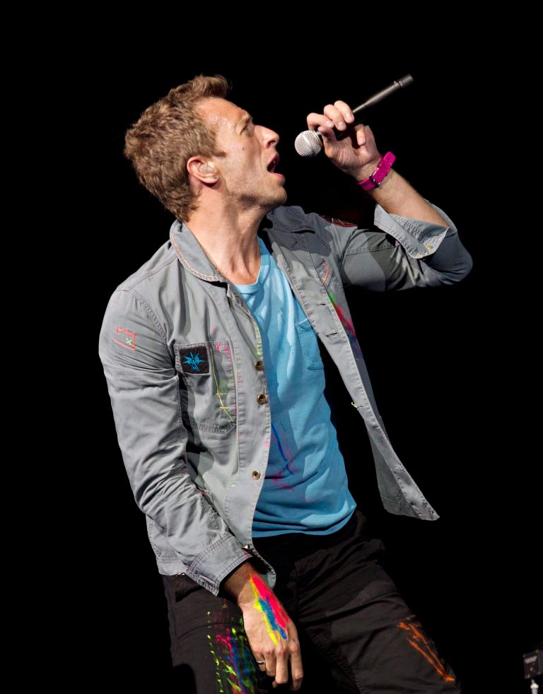   FILE - This April 17, 2012 file photo shows Chris Martin, lead singer of Coldplay, performing in Edmonton, Alberta, Canada. Coldplay and Eric Clapton have been added to the lineup for the 12-12-12 Hurricane Sandy benefit concert. It will be broadcast across 34 U.S. and international television, radio and Internet across six continents. Producers said Monday, Dec. 3, the concert will be available to 1 billion people across six continents. (AP Photo/The Canadian Press,Jason Franson)  