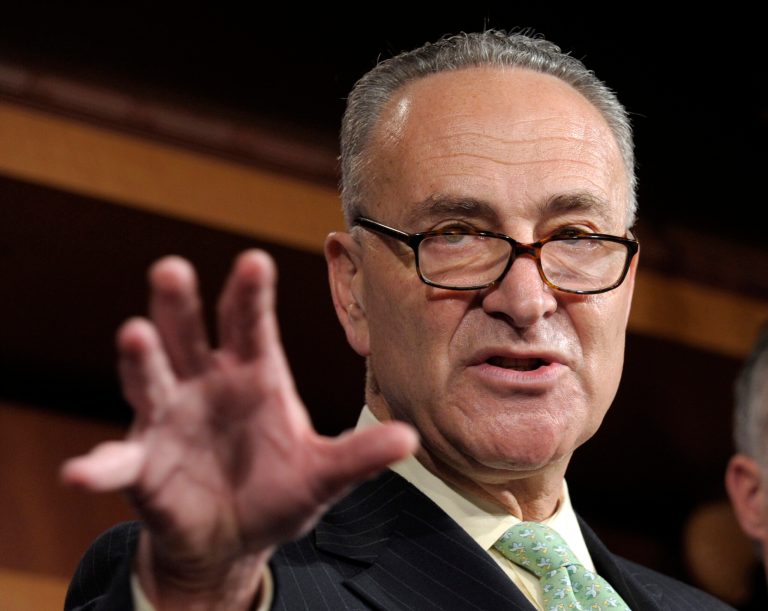 FILE - In this May 17, 2012 file photo, Sen. Charles Schumer, D-N.Y. gestures during a news conference on Capitol Hill in Washington. Big business and major labor unions appeared ready Friday, March 29, 2013 to end a fight over a new low-skilled worker program that had threatened to upend negotiations on a sweeping immigration bill in the Senate providing a pathway to citizenship for 11 million immigrants already in the U.S. Schumer, who's been brokering talks between the AFL-CIO and the Chamber of Commerce, said in a statement that negotiators are 