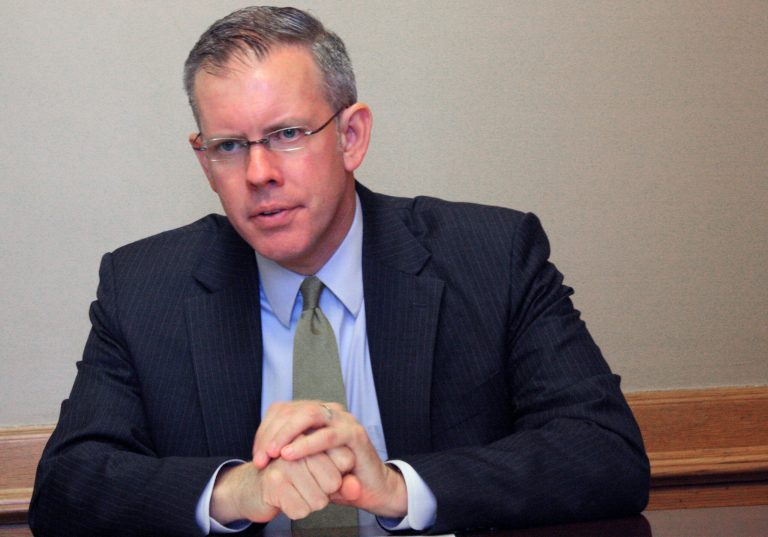 In this Friday, May 25, 2013 file photo, Kansas House Minority Leader Paul Davis answers questions from reporters during a news conference at the Statehouse in Topeka, Kan. Davis announced Tuesday, Oct. 22, 2013, that Jill Docking will be his running mate in his bid to challenge Republican Gov. Sam Brownback in 2014. Docking, 57, whose husband was lieutenant governor in the 1980s, was introduced Tuesday in Prairie Village as Davis kicked off a bus tour that will also take them to Topeka, Salina and Wichita. Docking ruled out her own run at governor this summer, saying she didn't know what her political future held. (AP Photo/John Milburn, File)