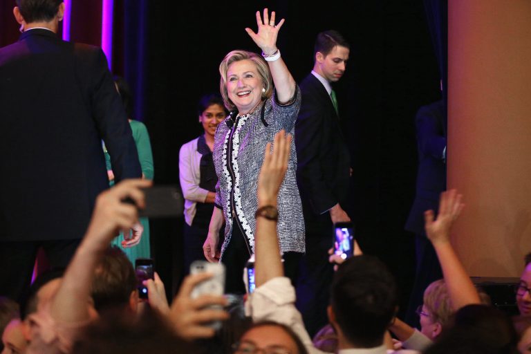 Former Secretary of State Hillary Clinton waves goodbye after discussing her new book, 'Hard Choices: A Memoir,' at the Lisner Auditorium on the campus of George Washington University June 13, 2014 in Washington. (Photo by Chip Somodevilla/Getty Images)