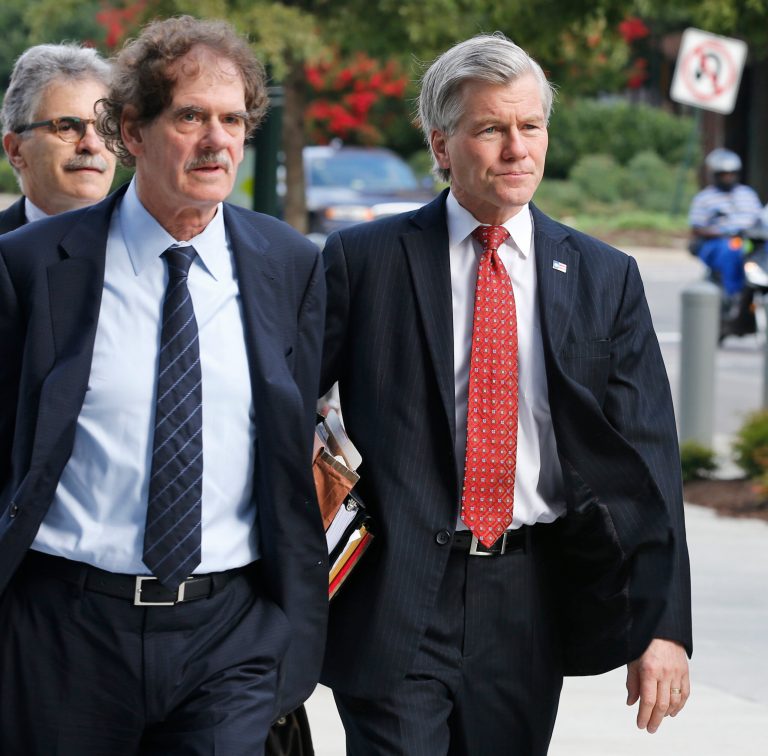 Former Virginia Gov. Bob McDonnell, right, arrives at federal court with his attorney Henry Asbill in Richmond, Va., Tuesday, Aug. 19, 2014. McDonnell is presenting the second day of his defense on corruption charges. (AP Photo/Steve Helber)