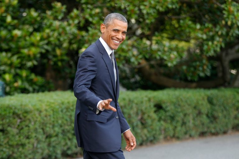 President Barack Obama walks on the South Lawn at the White House in Washington, Friday, July 18, 2014, as he boards Marine One helicopter to the presidential retreat at Camp David, Md. (AP Photo/Charles Dharapak)
