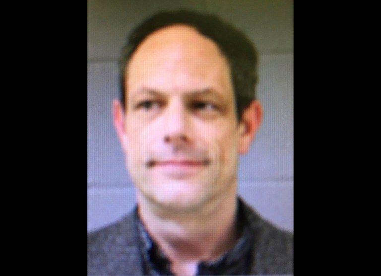 Jason Adams was arrested at Newtown Middle School after police say he was seen with a pistol and detained by school security. (Newtown Police Department via AP)