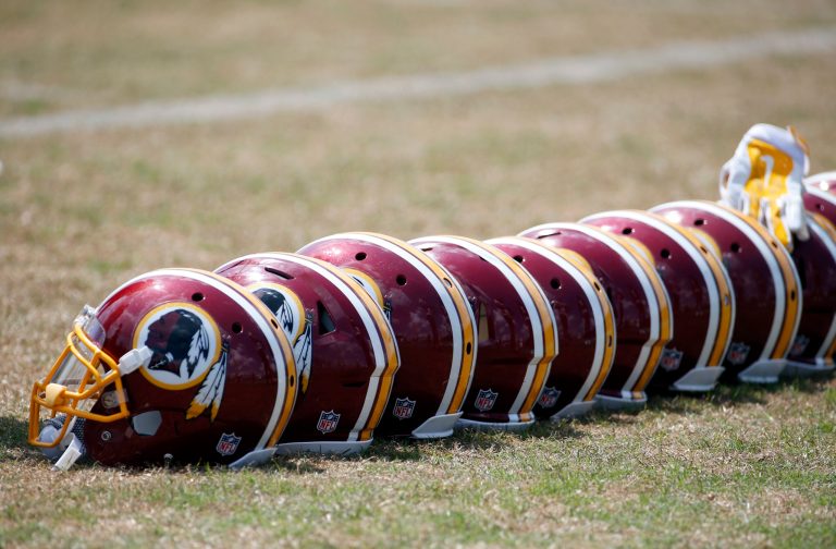 A row Washington Redskins helmets are seen during practice at the team's NFL football training facility at Redskins Park, Wednesday, June 1, 2016 in Ashburn, Va. (AP Photo/Alex Brandon)