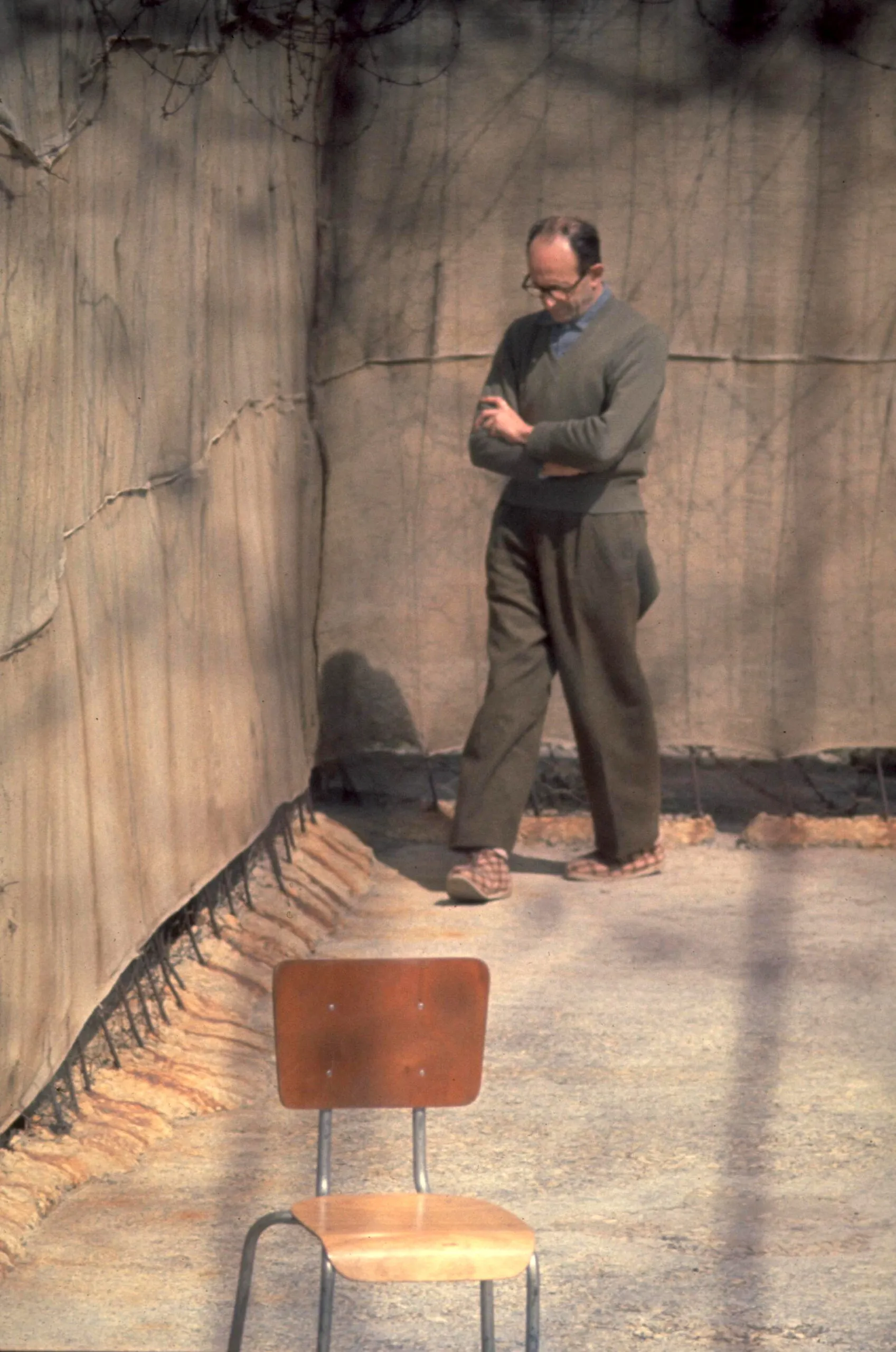 Adolf Eichmann pacing in the yard of Ayalon Prison in Israel, 1961.