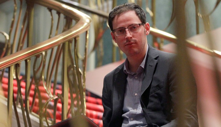Nate Silver sits on the stairs at Allegro hotel in downtown Chicago, Friday, Nov. 9, 2012.