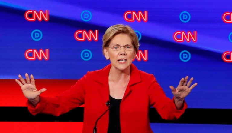 Sen. Elizabeth Warren, D-Mass., speaks as she participates in the first of two Democratic presidential primary debates hosted by CNN Tuesday, July 30, 2019, in the Fox Theatre in Detroit. Sen. Bernie Sanders, I-Vt., left, and former Texas Rep. Beto O'Rourke listen.