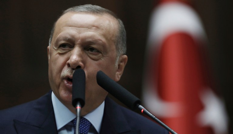 Turkish President Recep Tayyip Erdogan addresses his ruling party legislators at the Parliament, in Ankara, Wednesday, Oct 16, 2019. Erdogan called Wednesday on Syrian Kurdish fighters to leave a designated border area in northeast Syria 'as of tonight' for Turkey to stop its military offensive, defying pressure on him to call a ceasefire and halt its incursion into Syria.