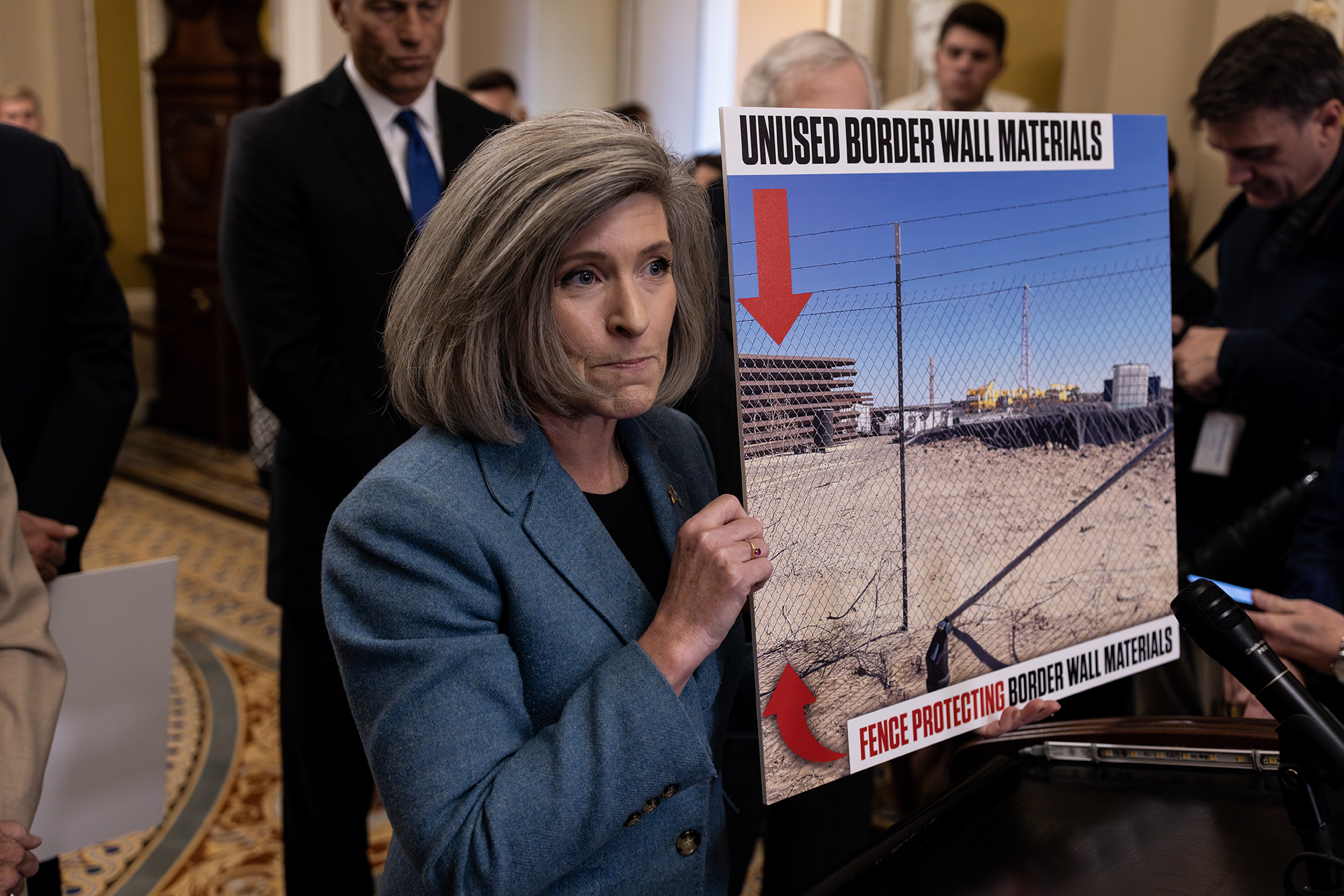 Senator Joni Ernst (R-IA) holds a photograph that she says is of a fence around sections of unbuilt wall near the U.S.-Mexico border during a news conference on Capitol Hill, on Tuesday, November 07, 2023. Ernst has criticized the Biden administration for ending construction of the Southern border wall.