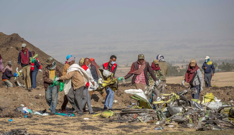 Rescuers work at the scene of an Ethiopian Airlines flight crash near Bishoftu, or Debre Zeit, south of Addis Ababa,  Ethiopia, Monday, March 11, 2019.