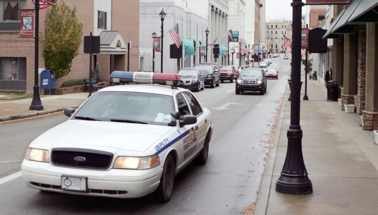 A Fayette County Sherrif's car drives through Uniontown, Pa. The elites, who have the power, money, influence and education in every aspect of society, find the way of life of those living in small towns to be intolerable. (AP Photo/Keith Srakocic)