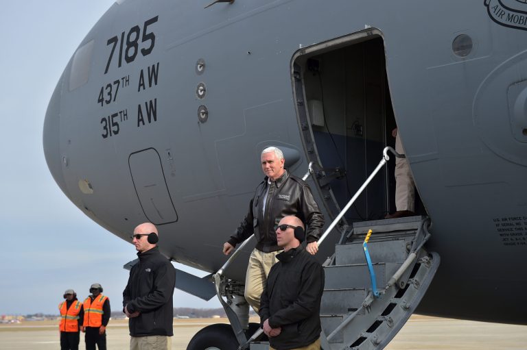 Vice President Mike Pence steps off an Air Force transport plane after arriving at at Andrews Air Force Base, Md., Friday, Dec. 22, 2017. Pence returned from a surprise trip to Afghanistan. (Mandel Ngan/Pool via AP)