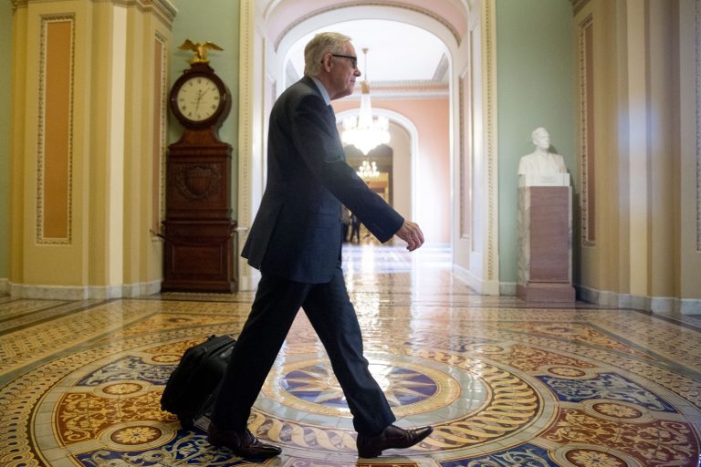 Senate Minority Leader Sen. Harry Reid of Nev. arrives at the Capitol Building before the Senate convenes for a Sunday session on Capitol Hill in Washington, Sunday, July 26, 2015. (AP Photo/Andrew Harnik)