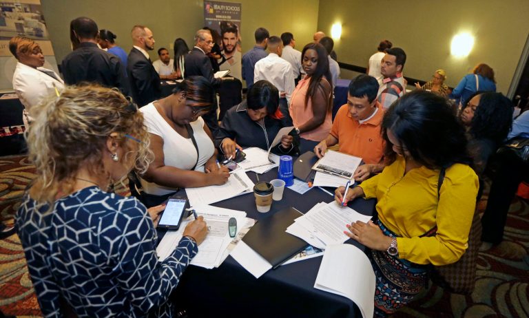 Job seekers attend a job fair in Miami Lakes, Fla. The Labor Department reports on the number of people who applied for unemployment benefits for the week ending July 11 on Thursday, July 16, 2015. (AP Photo/Alan Diaz)