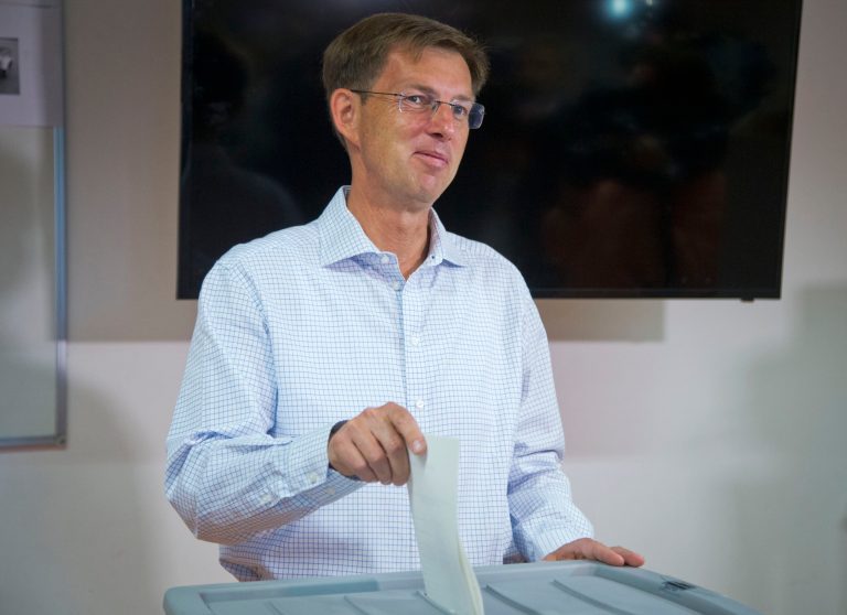Miro Cerar, politically-inexperienced law expert and parliamentary consultant, better known as the son of Olympic medalist Miroslav Cerar casts his ballot at a polling station in Ljubljana, Slovenia, Sunday, July 13, 2014. Slovenes are voting in the second early election in three years amid political instability that threatened the small euro zone nation's bid to pull out of an economic downturn. (AP Photo/Darko Bandic)