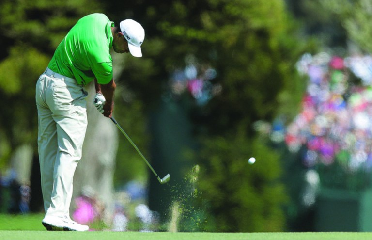 Charlie Riedel/AP
Tiger Woods will play at this week's AT&T National at Congressional after tying for 21st at the U.S. Open.