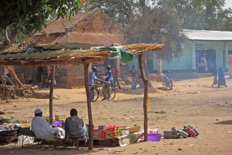 FOR STORY : CENTRAL AFRICAN REPUBLIC DIAMONDS - In this photo taken on Wednesday, April, 10, 2013, People await clients as they sell food staples at a street market in the town of Ndele, Central African Republic. Armed with rocket-propelled grenades and Kalashnikov rifles, Seleka rebels who ousted Central African Republic's president six weeks ago seem to be solidifying their control over the country's lucrative diamond industry and have even been selling some of the stones, according to reports from unidentified witnesses in the country's isolated and violent north. (AP Photo/Krista Larson)