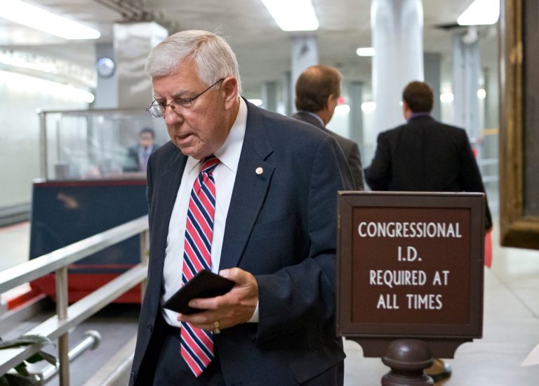 Sen. Mike Enzi, R-Wyo., walks to the floor of the Senate for a vote, Thursday, July 18, 2013, at the Capitol in Washington. Liz Cheney, elder daughter of former Vice President Dick Cheney, announced this week that she will run against Enzi, a three-term incumbent and fellow Republican.  (AP Photo/J. Scott Applewhite)