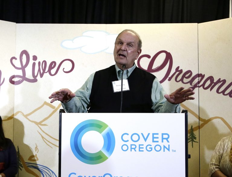 In this Oct. 1, 2013 file photo, Cover Oregon executive director Rocky King speaks during the rollout of Oregon's health insurance exchange in Portland, Ore. (AP Photo/Don Ryan, File)