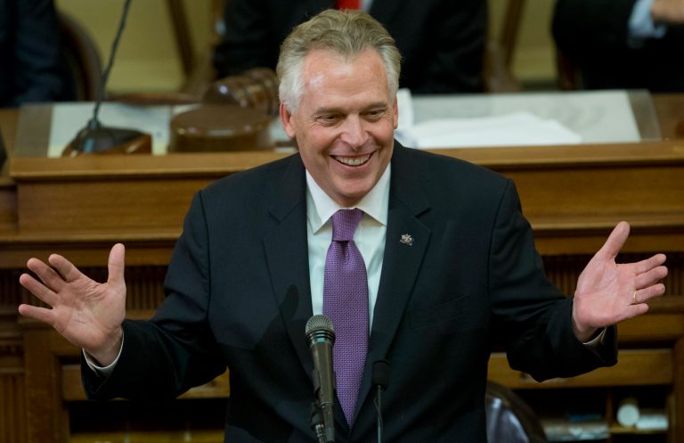 Virginia Gov. Terry McAuliffe gestures as he addresses a joint session of the the 2018 session in the House chambers at the Capitol in Richmond, Va., Wednesday, Jan. 10, 2018. (AP Photo/Steve Helber)