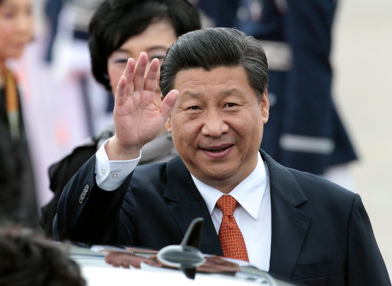 Chinese President Xi Jinping waves upon his arrival at Seoul Military Airport in Seongnam, South Korea. Thursday, July 3, 2014. (AP Photo/Ahn Young-joon).