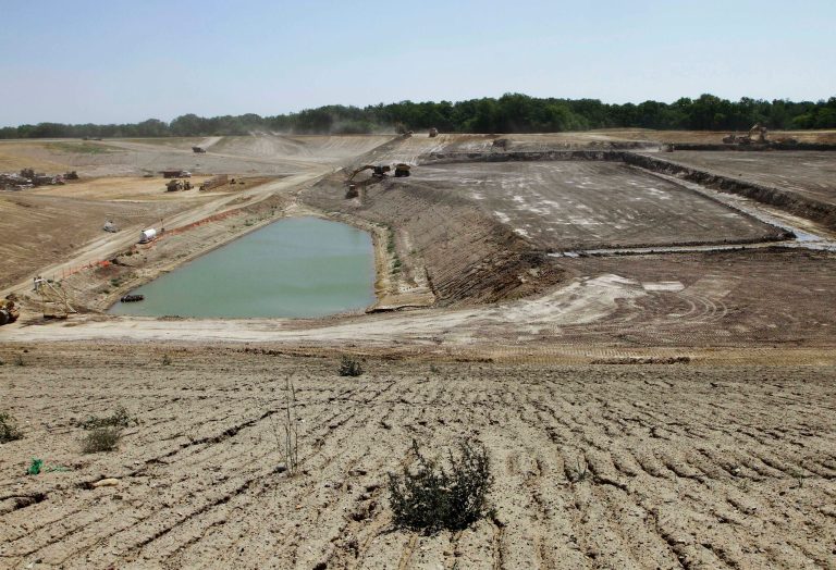 FILE - In this June 20, 2012 file photo, construction is seen going on at the Clinton Landfill near Clinton, Ill. Illinois Gov. Pat Quinn believes approvals the central Illinois county gave to the landfill did not include the potential storage of toxic PCBs the facility's owner now wants to store. If that's true, Quinn spokesman Dave Blanchette said Tuesday, July 22, 2014, that state law might allow the Illinois Environmental Protection Agency to withdraw its approval of the plan to store toxic waste at Clinton. The landfill sits over the Mahomet aquifer, a source of drinking water for thousands of people across central Illinois. (AP Photo/Seth Perlman, File)