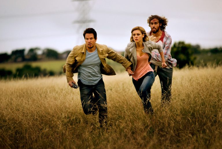 This photo released by Paramount Pictures shows, from left,  Mark Wahlberg, as Cade Yeager, Nicola Peltz as Tessa Yeager, and T.J. Miller as Lucas Flannery, in 