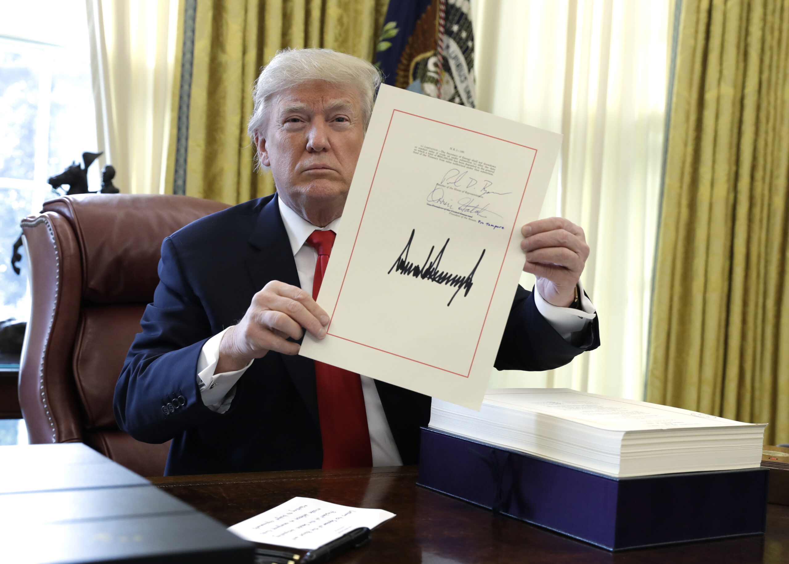 White House Report Card: Big win on taxes boosts Trump