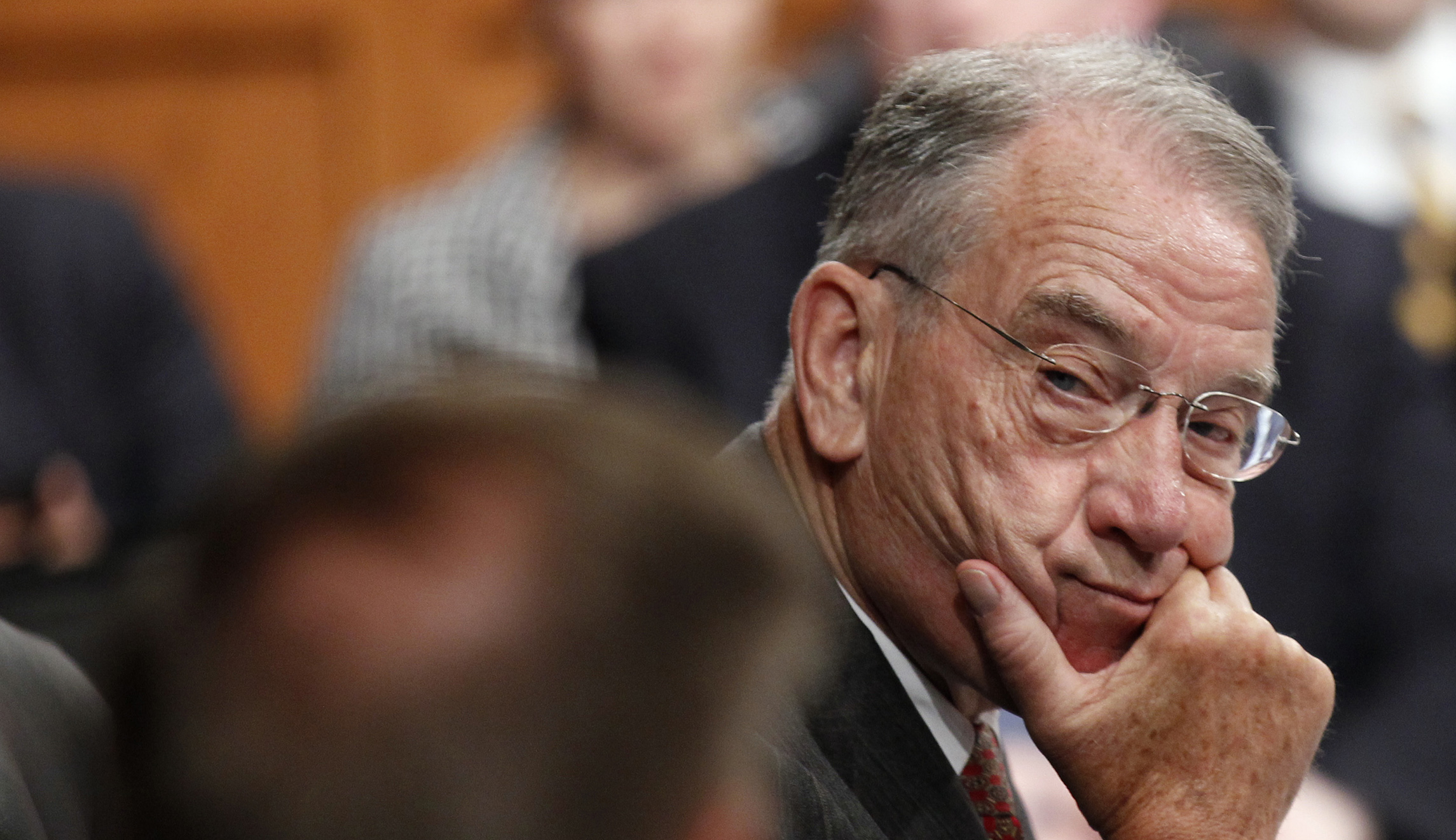 Why was Chuck Grassley wearing two pairs of glasses?