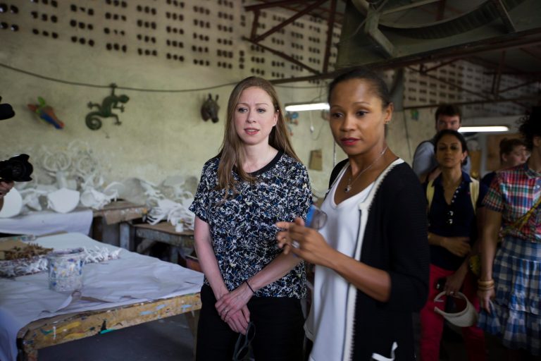 Chelsea Clinton, left, walks around in Port-au-Prince, Haiti in July. ( AP Photo/Dieu Nalio Chery)