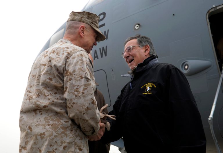   U.S. Defense Secretary Leon Panetta, right, is greeted by Marine Gen. John R. Allen, left, commander of International Security Assistance Force, upon his arrival at Kabul International Airport in Kabul, Afghanistan, Wednesday, Dec. 12, 2012. Panetta is expected to meet with troops as part of a holiday visit to thank the troops for their service. (AP Photo/Susan Walsh, Pool)  