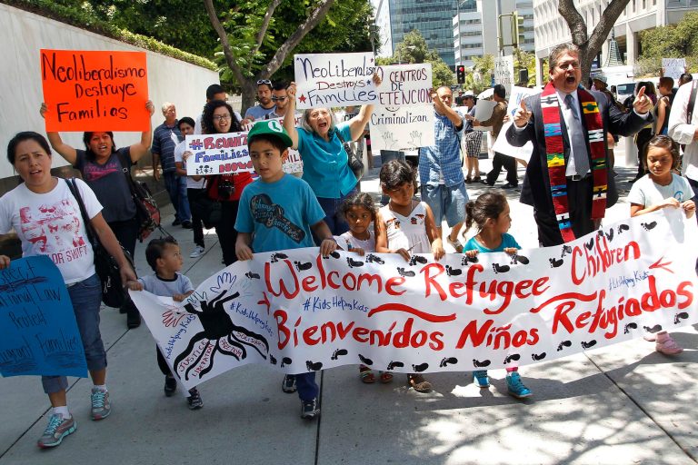 Immigrant families and children's advocates rally in response to President Barack Obama's statement on the crisis of unaccompanied children and families illegally entering the United States, outside the Los Angeles Federal building Monday, July 7, 2014. A top Obama administration official says no one, not even children trying to escape violent countries, can illegally enter the United States without eventually facing deportation proceedings. (AP Photo/ Nick Ut)