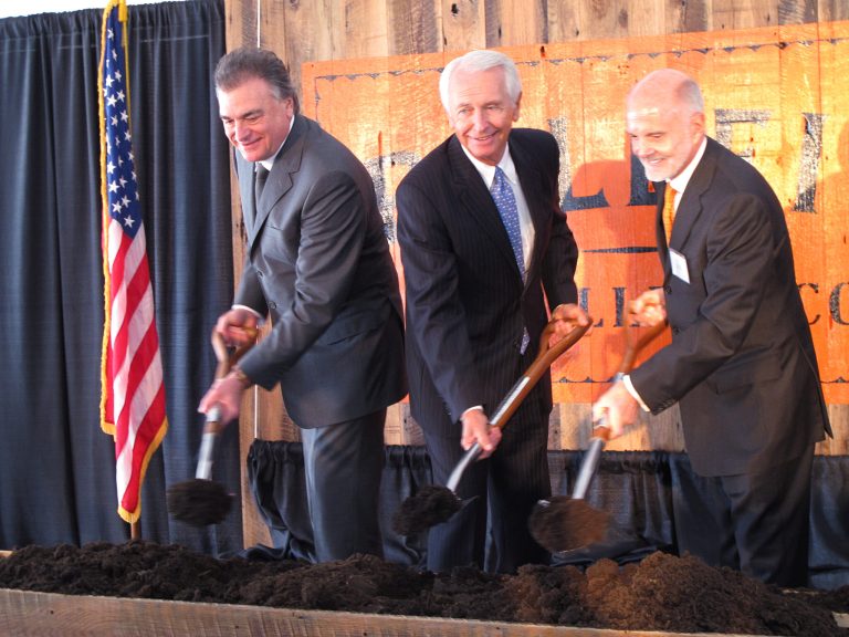 Diageo executive Larry Schwartz (far left), Kentucky Gov. Steve Beshear (center) and Bulleit Bourbon founder Tom Bulleit participate in a groundbreaking for a new Diageo distillery on Thursday, Aug. 21, 2014, at Shelbyville, Ky. Diageo plans to expand sales of Bulleit bourbon and rye whiskeys that will be made at the new Kentucky distillery expected to start production in late 2016. (AP Photo/Bruce Schreiner)