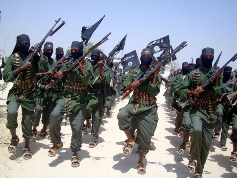   FILE - In this Thursday, Feb.17, 2011 file photo, al-Shabab fighters march with their weapons during military exercises on the outskirts of Mogadishu, Somalia. An intelligence intercept from al-Qaida-linked Somali militant group al-Shabab shows that insurgents are being offered up to $8,000 to kill Kenyan security officers, a Kenyan official said Thursday, Dec. 13, 2012. (AP Photo/Mohamed Sheikh Nor, File)  